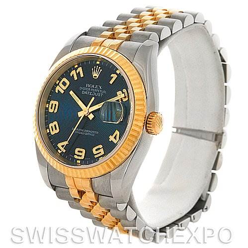 This image shows a Rolex Datejust 116233 Men
s Stainless Steel Blue Dial 116233 Men
s Stainless Steel Blue Dial watch at a three-quarter angle, featuring a gold and silver jubilee bracelet, and a blue dial with Arabic numerals.