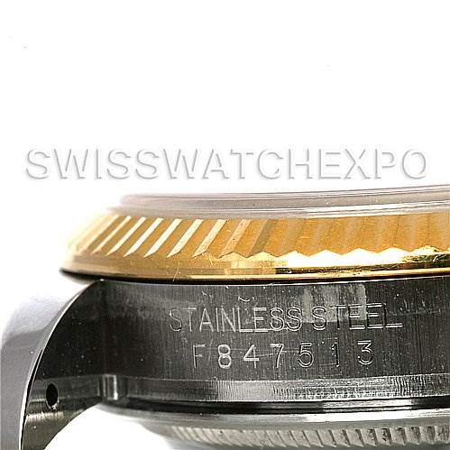 This image shows a close-up side view of the case and fluted bezel of a Rolex Datejust 116233 Men
s Stainless Steel Blue Dial 116233 Men
s Stainless Steel Blue Dial watch.