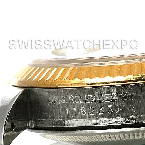 This close-up image shows the side view of a Rolex Datejust 116233 Men
s Stainless Steel Blue Dial 116233 Men
s Stainless Steel Blue Dial watch, highlighting the engraved design number and the fluted bezel.