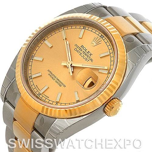 The image shows a Rolex Datejust 116233 Men
s Stainless Steel Champagne Dial 116233 Men
s Stainless Steel Champagne Dial model watch from an angle highlighting the face, bezel, crown, and a portion of the bracelet.