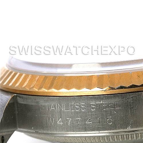This image shows a side view of a Rolex Datejust 16233 Men's Steel and Gold (two tone) Champagne Dial 16233 Men's Steel and Gold (two tone) Champagne Dial watch, highlighting the stainless steel case and the fluted bezel.
