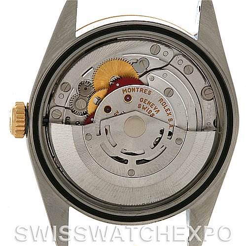 The image shows the back view of a Rolex Datejust 16233 Men's Steel and Gold (two tone) Champagne Dial 16233 Men's Steel and Gold (two tone) Champagne Dial watch, highlighting its internal mechanical components.