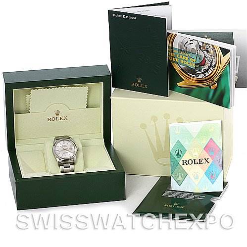 The image shows a Rolex Datejust 16200 Men's Stainless Steel Silver Dial 16200 Men's Stainless Steel Silver Dial watch in its box, accompanied by manuals, booklets, and a Rolex-branded cleaning cloth.