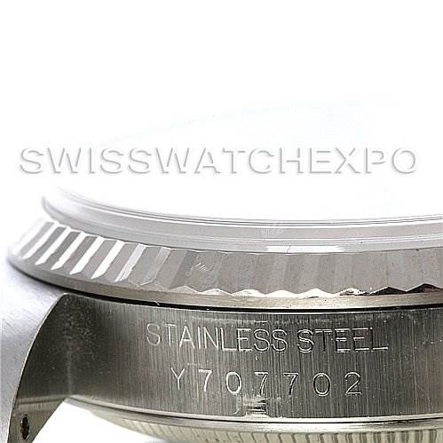The image shows a close-up side view of the Rolex Datejust 16234 Men's Stainless Steel Grey Dial 16234 Men's Stainless Steel Grey Dial watch, focusing on the bezel and part of the case with a visible serial number.
