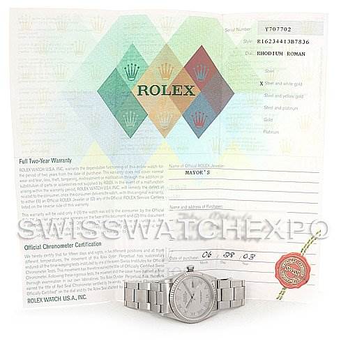The image shows a Rolex Datejust 16234 Men's Stainless Steel Grey Dial 16234 Men's Stainless Steel Grey Dial watch laying flat, accompanied by its warranty and certification papers.