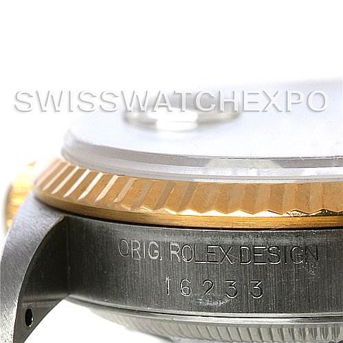 The image shows a close-up of the side of a Rolex Datejust 16233 Men's Steel and Gold (two tone) Beige Dial 16233 Men's Steel and Gold (two tone) Beige Dial watch case, highlighting the fluted bezel and engraved serial number 16233.