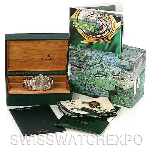 The image shows a Rolex Datejust 16233 Men's Steel and Gold (two tone) Grey Dial 16233 Men's Steel and Gold (two tone) Grey Dial watch at an angle inside its box, with accompanying booklets and accessories displayed.