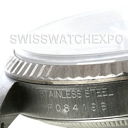 The image shows a close-up side angle of the case and bezel of a Rolex Datejust 16234 Men's Stainless Steel Black Dial 16234 Men's Stainless Steel Black Dial, highlighting the serial number and "STAINLESS STEEL" engraving.