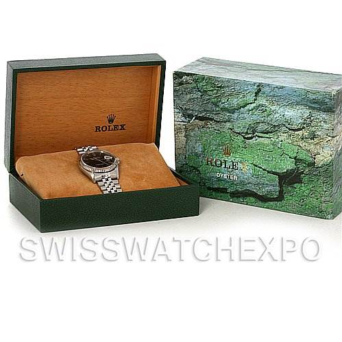 The image shows a Rolex Datejust 16234 Men's Stainless Steel Black Dial 16234 Men's Stainless Steel Black Dial watch in an open green box next to a matching exterior box.