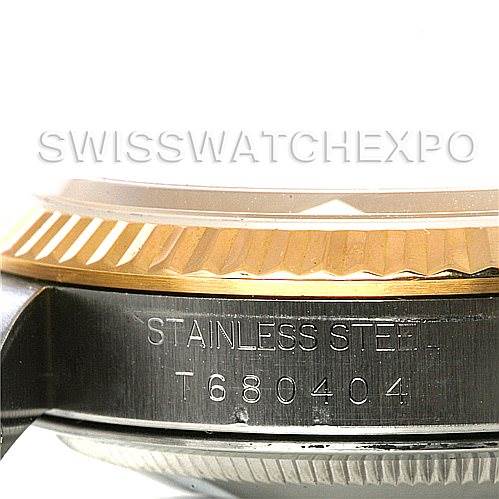 This image shows a close-up side view of the case and fluted bezel of a Rolex Datejust 16233 Men's Steel and Gold (two tone) White Dial 16233 Men's Steel and Gold (two tone) White Dial model watch, highlighting its stainless steel part.