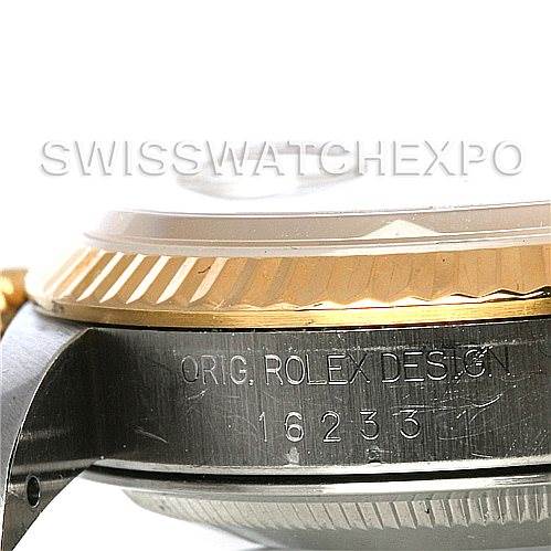 This close-up image of a Rolex Datejust 16233 Men's Steel and Gold (two tone) White Dial 16233 Men's Steel and Gold (two tone) White Dial watch shows the side of the case, including the model and serial number engraving.