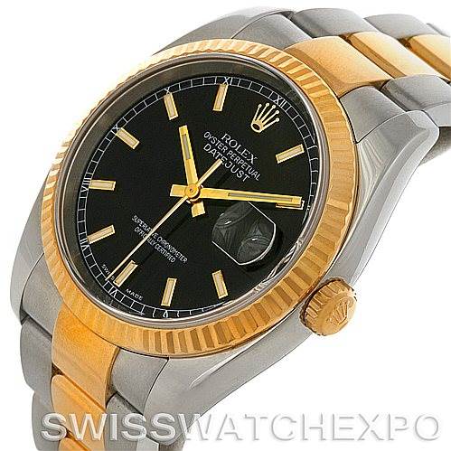 The image shows a Rolex Datejust 116233 Men's Stainless Steel Black Dial 116233 Men's Stainless Steel Black Dial model watch from an angle highlighting its black dial, gold bezel, crown, and two-tone bracelet.
