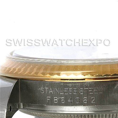 This image shows a close-up of the Rolex Datejust 116233 Men's Stainless Steel Black Dial 116233 Men's Stainless Steel Black Dial model, focusing on the stainless steel case and serial number engraving.