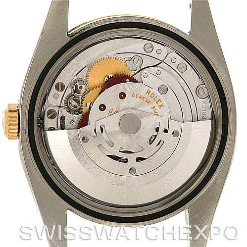 The image shows the Rolex Datejust 116233 Men's Stainless Steel Black Dial 116233 Men's Stainless Steel Black Dial watch from the back, revealing its internal movement and mechanism.