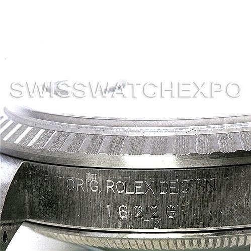 The image shows the side view of a Rolex Datejust 16220 Men's Stainless Steel Blue Dial 16220 Men's Stainless Steel Blue Dial watch, highlighting the fluted bezel and the engraved model number "16220".