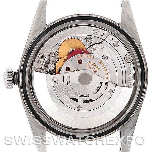 The image shows the internal movement of a Rolex Datejust 16220 Men's Stainless Steel Blue Dial 16220 Men's Stainless Steel Blue Dial watch from the back, showcasing the automatic mechanism and rotor.