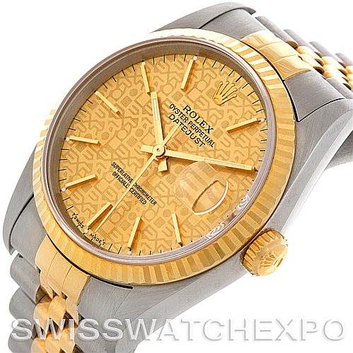 This image shows a close-up, angled view of the dial, bezel, and crown of a Rolex Datejust 16233 Men's Steel and Gold (two tone) Champagne Dial 16233 Men's Steel and Gold (two tone) Champagne Dial watch.