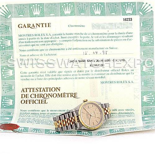The image shows a Rolex Datejust 16233 Men's Steel and Gold (two tone) Champagne Dial 16233 Men's Steel and Gold (two tone) Champagne Dial watch placed on top of its official warranty and chronometer certificate.