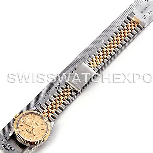 The image shows a Rolex Datejust 16233 Men's Steel and Gold (two tone) Champagne Dial 16233 Men's Steel and Gold (two tone) Champagne Dial watch laid flat with its full length visible, next to a ruler for scale.