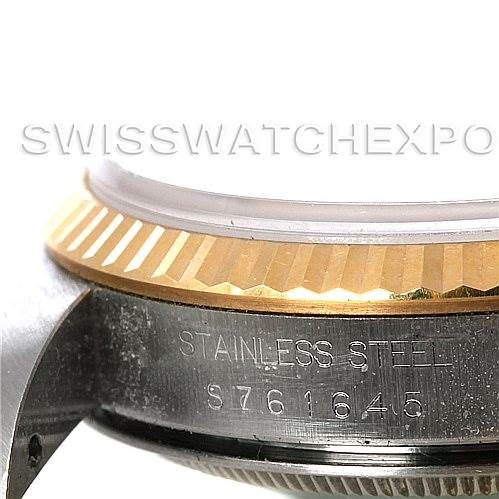 This image shows a close-up of the side of a Rolex Datejust 16233 Men's Steel and Gold (two tone) Champagne Dial 16233 Men's Steel and Gold (two tone) Champagne Dial watch, featuring the engraved serial number and part of the bezel.
