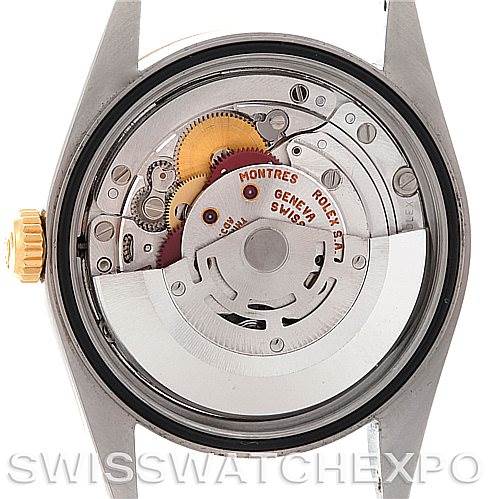 The image shows the internal movement of a Rolex Datejust 16233 Men's Steel and Gold (two tone) Champagne Dial 16233 Men's Steel and Gold (two tone) Champagne Dial watch from a rear view, showcasing gears and the rotor.