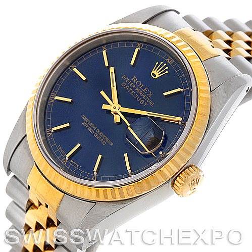 This image shows a Rolex Datejust 16233 Men's Steel and Gold (two tone) Blue Dial 16233 Men's Steel and Gold (two tone) Blue Dial watch at a slight angle, highlighting the blue dial, gold fluted bezel, and two-tone Jubilee bracelet.