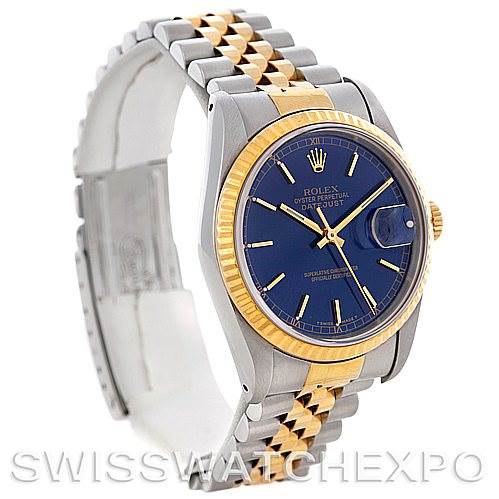 The image shows a side angle of a Rolex Datejust 16233 Men's Steel and Gold (two tone) Blue Dial 16233 Men's Steel and Gold (two tone) Blue Dial watch highlighting its two-tone bracelet, blue dial, and fluted gold bezel.