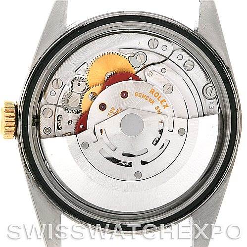 The image shows the back of the Rolex Datejust 16233 Men's Steel and Gold (two tone) Blue Dial 16233 Men's Steel and Gold (two tone) Blue Dial watch, revealing its internal movement and mechanisms.