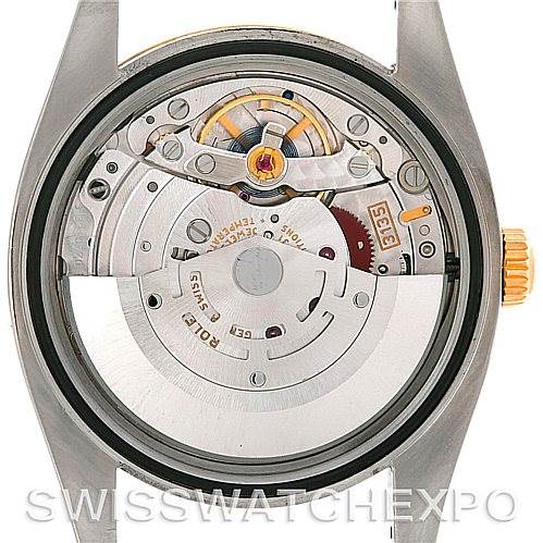 This image shows the internal movement of a Rolex Datejust 116203 Men's Stainless Steel White Dial 116203 Men's Stainless Steel White Dial watch from a straight-on angle.