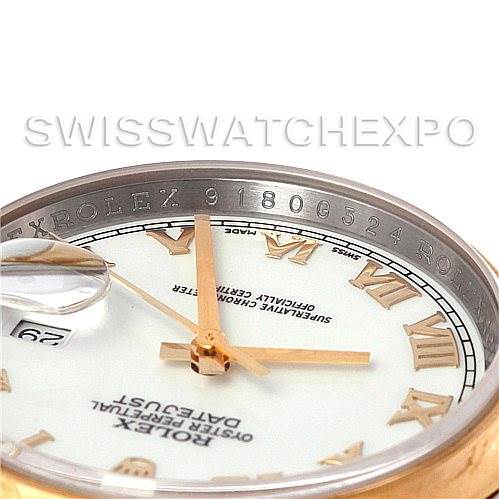 This image shows a close-up of the dial and Roman numerals of a Rolex Datejust 116203 Men's Stainless Steel White Dial 116203 Men's Stainless Steel White Dial with part of the bezel and date magnifier.