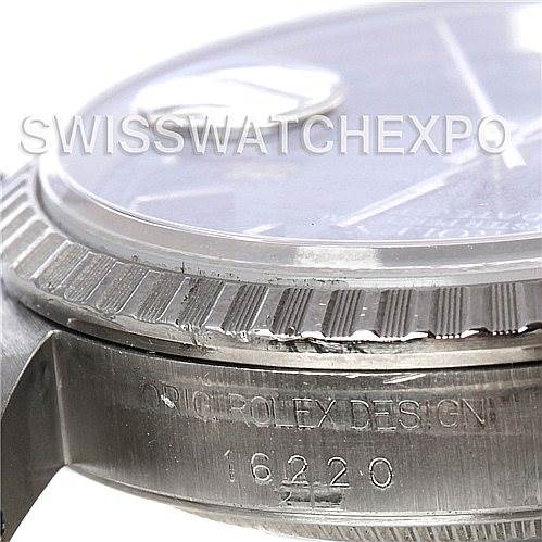 This image shows a close-up side angle of the Rolex Datejust 16220 Men's Stainless Steel Blue Dial 16220 Men's Stainless Steel Blue Dial watch, focusing on the bezel, crystal, and model number 16220 engraving.