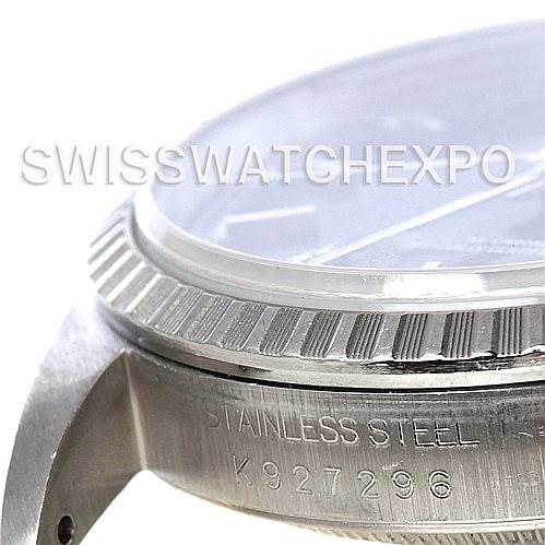 This image displays a close-up of the side of a Rolex Datejust 16220 Men's Stainless Steel Blue Dial 16220 Men's Stainless Steel Blue Dial watch, focusing on the stainless steel bezel and case with engraving.