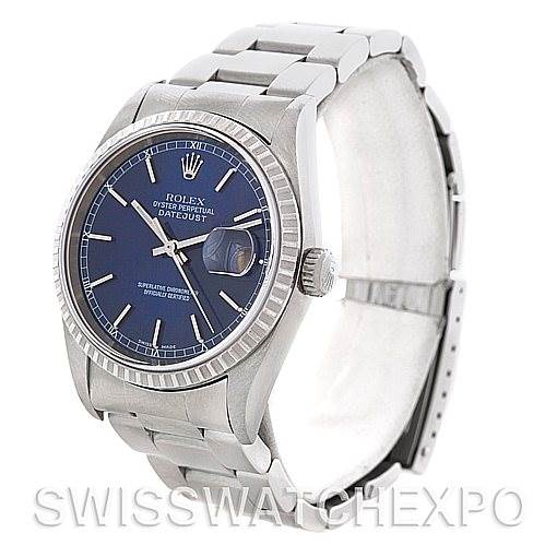 The image shows a side-angle view of a Rolex Datejust 16220 Men's Stainless Steel Blue Dial 16220 Men's Stainless Steel Blue Dial watch with a blue dial, fluted bezel, and stainless steel bracelet.