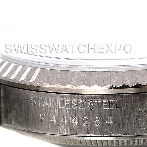 The image shows a close-up angle of the case side and fluted bezel of a Rolex Datejust 16234 Men's Stainless Steel Silver Dial 16234 Men's Stainless Steel Silver Dial watch, highlighting the stainless steel engraving and serial number.