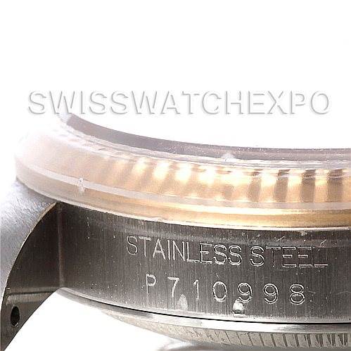 This is a close-up side view of a Rolex Datejust 16233 Men's Steel and Gold (two tone) White Dial 16233 Men's Steel and Gold (two tone) White Dial watch, showing the stainless steel part with an engraved serial number.