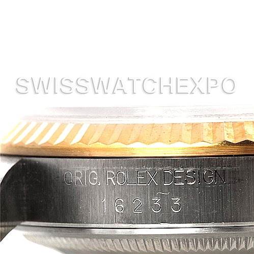 The image shows a close-up of the case side of a Rolex Datejust 16233 Men's Steel and Gold (two tone) White Dial 16233 Men's Steel and Gold (two tone) White Dial watch, highlighting the serial number and design engraving.