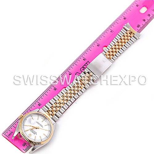 The image shows a Rolex Datejust 16233 Men's Steel and Gold (two tone) White Dial 16233 Men's Steel and Gold (two tone) White Dial watch laid flat next to a ruler, highlighting its full bracelet length and face.