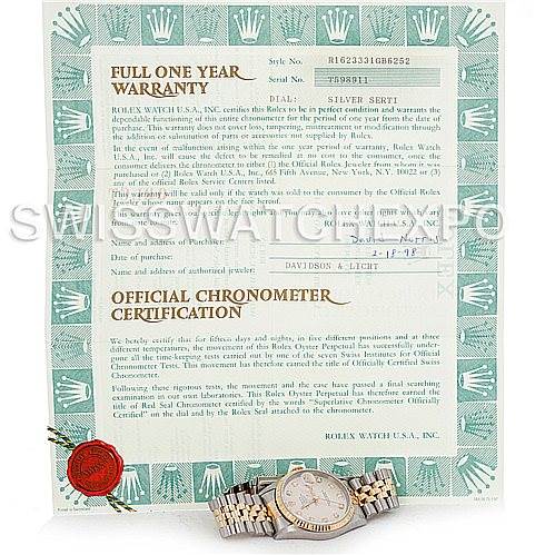 The image shows a Rolex Datejust 16233 Men's Steel and Gold (two tone) Silver Dial 16233 Men's Steel and Gold (two tone) Silver Dial model watch and its warranty and certification papers laid flat.