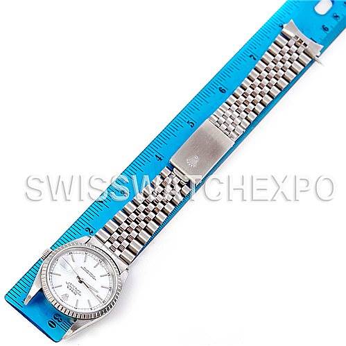 The image shows a Rolex Datejust 16220 Men's Stainless Steel Silver Dial 16220 Men's Stainless Steel Silver Dial watch laid flat with the band extended along a ruler, highlighting the watch face and bracelet.