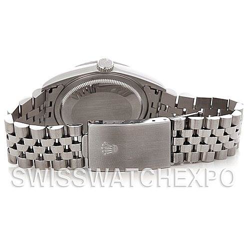 The image shows the backside of a Rolex Datejust 16220 Men's Stainless Steel Silver Dial 16220 Men's Stainless Steel Silver Dial watch, highlighting its clasp and stainless steel Jubilee bracelet.