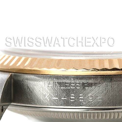 The image shows a close-up side view of the stainless steel and gold bezel of a Rolex Datejust 16233 Men's Steel and Gold (two tone) White Dial 16233 Men's Steel and Gold (two tone) White Dial watch, including its serial number.