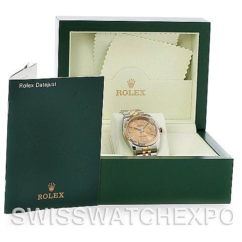 This image shows a Rolex Datejust 116233CSJ Men
s Stainless Steel Champagne Dial 116233CSJ Men
s Stainless Steel Champagne Dial watch in its box, accompanied by a booklet and cleaning cloths, viewed from the front.