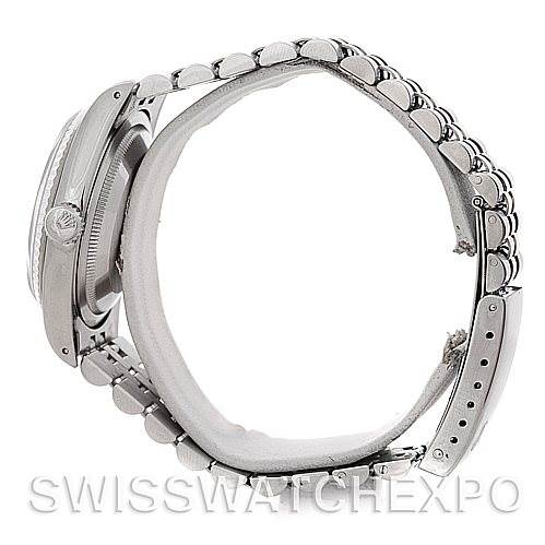 Side view of a Rolex Datejust 16234 Men's Stainless Steel Blue Dial 16234 Men's Stainless Steel Blue Dial watch showing the bracelet, case, and partially the crown.