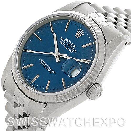 The image shows a Rolex Datejust 16234 Men's Stainless Steel Blue Dial 16234 Men's Stainless Steel Blue Dial watch at an angled view highlighting its blue dial, fluted bezel, date window, and jubilee bracelet.