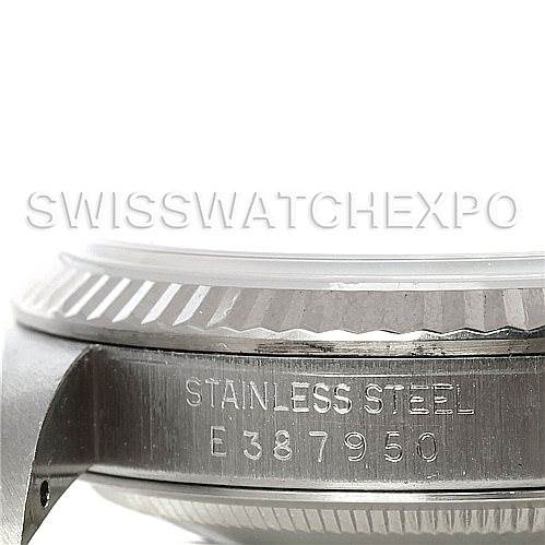 The image shows a side view of the Rolex Datejust 16234 Men's Stainless Steel White Dial 16234 Men's Stainless Steel White Dial watch, focusing on the bezel and stainless steel case with a serial number.