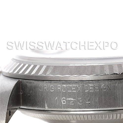 This image shows a close-up side view of the Rolex Datejust 16234 Men's Stainless Steel White Dial 16234 Men's Stainless Steel White Dial watch case, highlighting the bezel and serial number engraving.