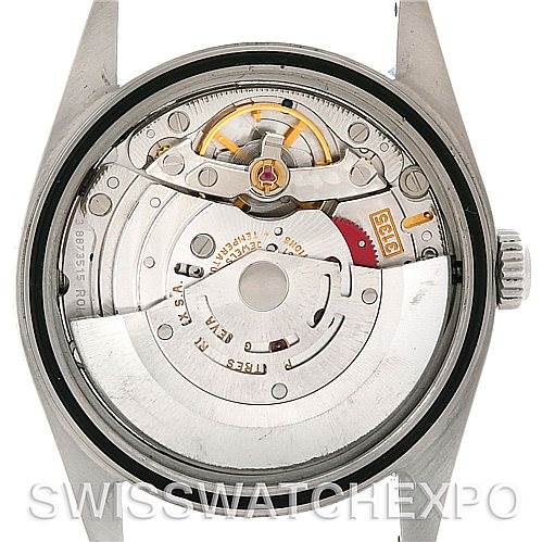 The image shows the back view of a Rolex Datejust 16220 Men's Stainless Steel Silver Dial 16220 Men's Stainless Steel Silver Dial watch, revealing its inner mechanical movement components.