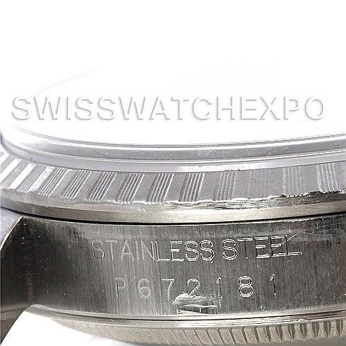 This image shows a close-up angle of the engraved serial number and part of the bezel of a Rolex Datejust 16220 Men's Stainless Steel Silver Dial 16220 Men's Stainless Steel Silver Dial watch.