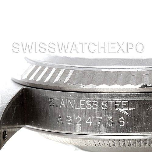 This image shows the side angle of the Rolex Datejust 16234 Men's Stainless Steel Black Dial 16234 Men's Stainless Steel Black Dial watch case, displaying the "Stainless Steel" engraving and serial number.