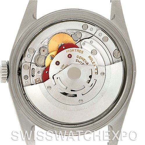 The image shows the inner mechanism of a Rolex Datejust 16234 Men's Stainless Steel Black Dial 16234 Men's Stainless Steel Black Dial watch viewed from the back, highlighting gears and the rotor.